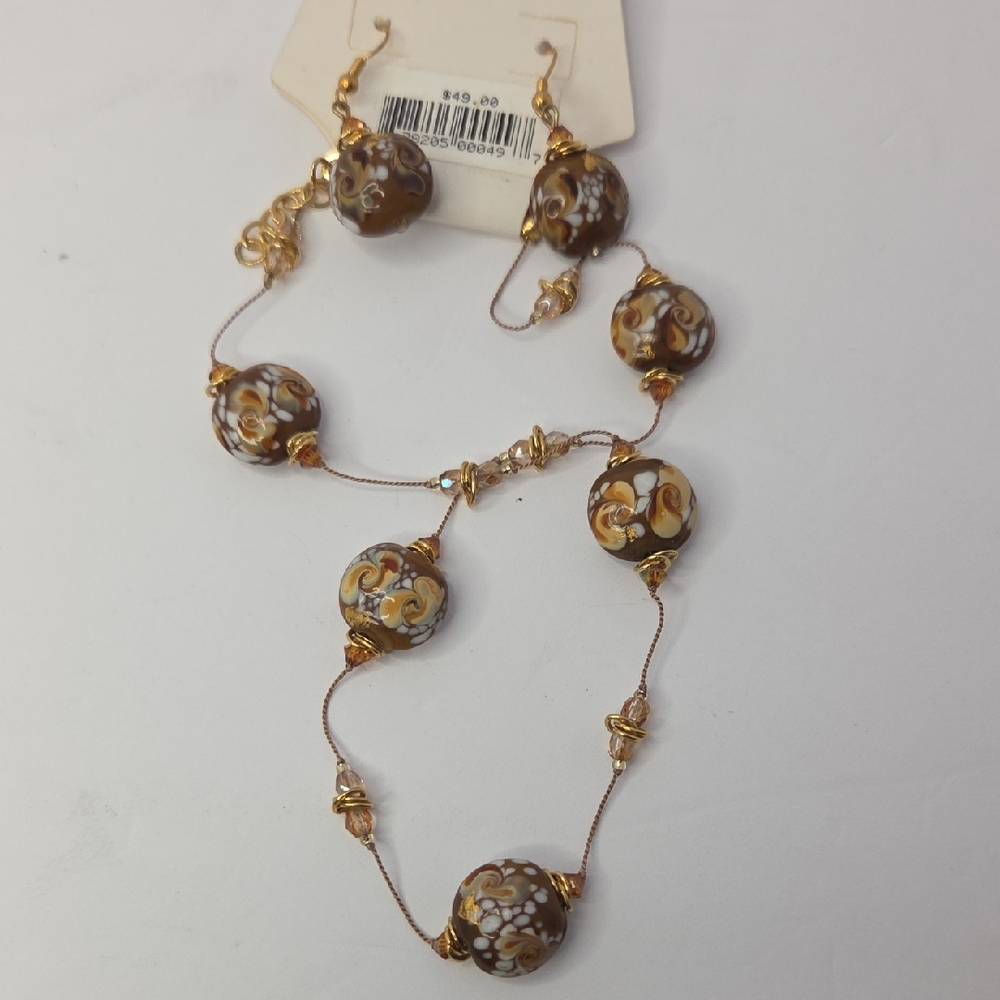 Jewelry set features brown and white swirled glass beads with Swaroski Crystals